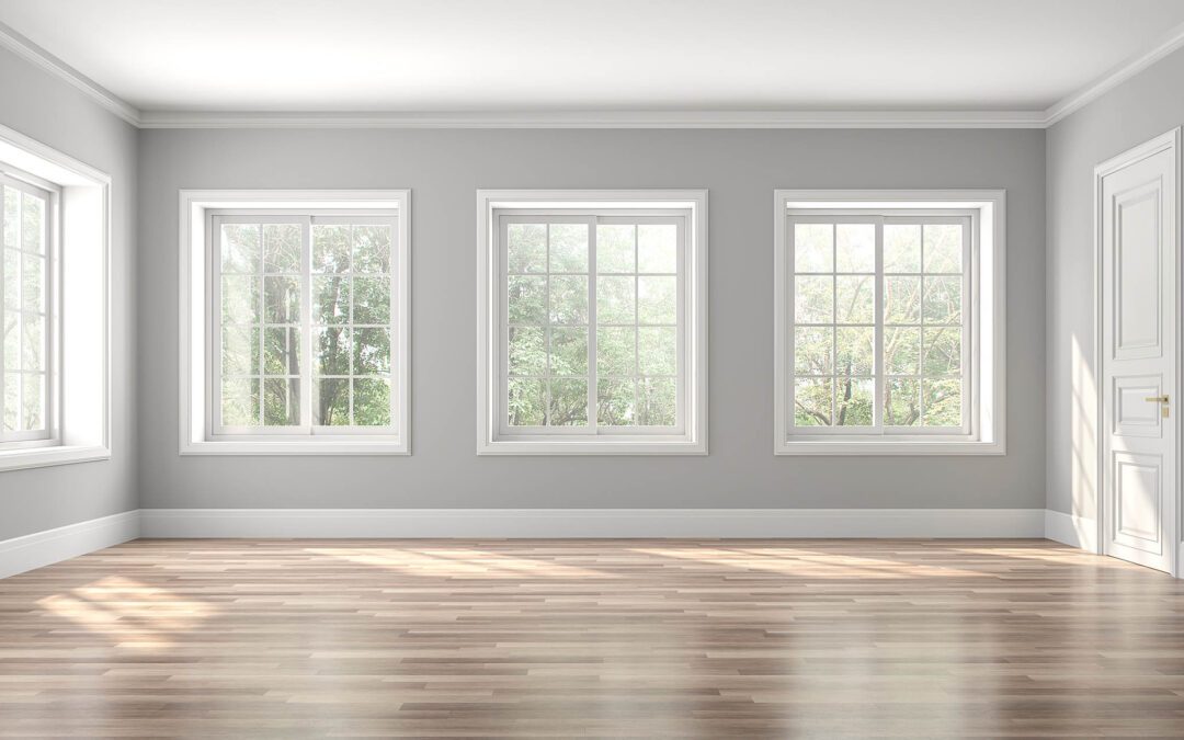 Bright, freshly painted interior room with wood floors