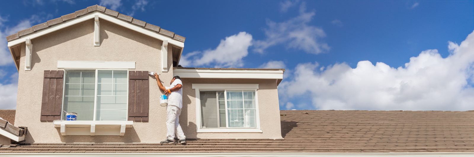 Our painter carefully coating a home's exterior trim